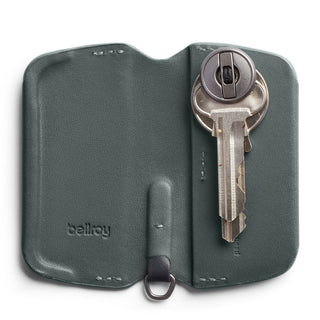 Bellroy Key Cover Third Edition in gray leather holding two metal keys with embossed logo visible