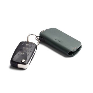 Bellroy Key Cover Third Edition in green leather attached to a black car remote key fob