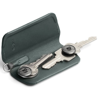 Bellroy Key Cover Plus Third Edition in dark green leather holding two metal keys inside open case