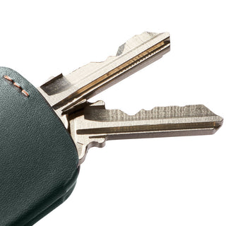 Bellroy Key Cover Plus Third Edition showing green leather texture with two keys partially inserted