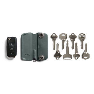 Bellroy Key Cover Plus Third Edition in green leather with keys and car key fob arranged separately