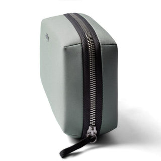 Bellroy Tech Kit in green recycled fabric with black zipper and compact rectangular shape side view