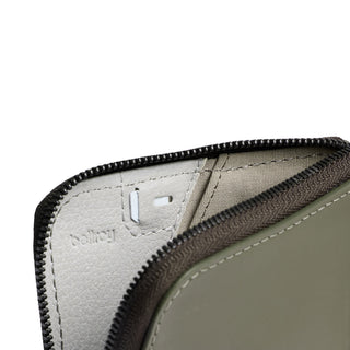 Bellroy Card Pocket close-up showing soft leather interior with subtle embossed logo and zipper detail