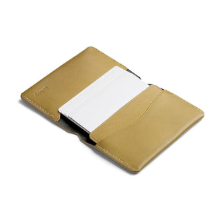 Bellroy Under Cover card holder in tan leather with visible stitching and multiple card slots open