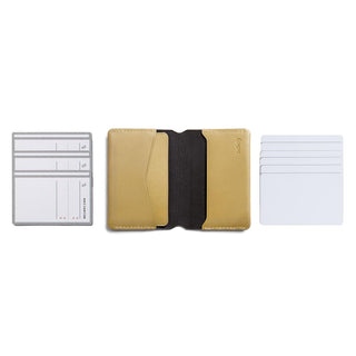 Bellroy Under Cover card holder in tan leather with black interior and multiple card slots displayed flat