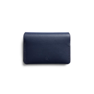 Bellroy Under Cover card holder in navy leather with subtle embossed logo and stitched edges