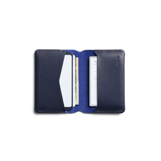Bellroy Under Cover navy leather cardholder open showing multiple card slots and interior texture