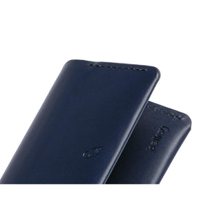 Bellroy Under Cover slim navy blue leather card sleeves with stitched edges and embossed logo detail