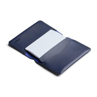 Bellroy Under Cover navy leather card holder open to display multiple card slots and stitching details