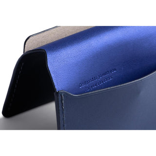 Bellroy Under Cover wallet showing smooth blue leather with embossed text inside card slot