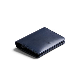 Bellroy Under Cover navy blue leather card holder with sleek minimalist design and embossed logo