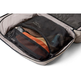 Bellroy Lite Travel Pack 38L open showing organized interior mesh compartments with packed travel essentials