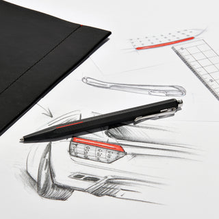 Caran d'Ache Matt Ecridor Racing Ballpoint Pen with hexagonal matte black body and red lacquer detail on sketches