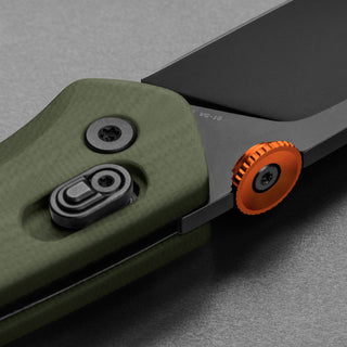 James The Carter Knife with green Micarta handle and orange thumb stud close-up detail