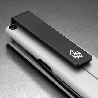 James The Chapter 2 Knife closed showing matte titanium handle and black clip with The James Brand logo