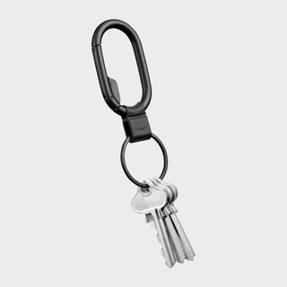 Orbitkey Clip Mini black zinc alloy keychain clip holding several silver keys on gray background