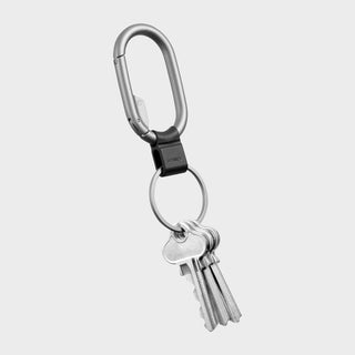 Orbitkey Clip Mini with zinc alloy clip and quick-release keyring holding four silver keys on white background