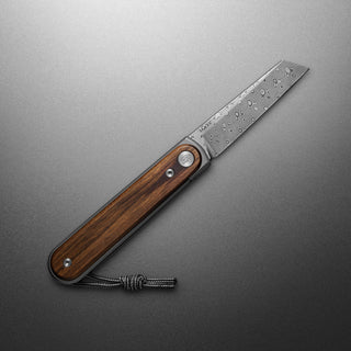 James The Duval Knife with polished rosewood handle and patterned Damascus-style blade open flat
