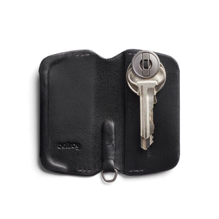 Bellroy Key Cover Third Edition in black leather, open with key inserted, textured interior visible