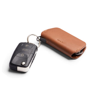 Bellroy Key Cover Third Edition in tan leather with key fob attached on white background