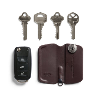 Bellroy Key Cover Third Edition in brown leather shown open with keys and car fob nearby
