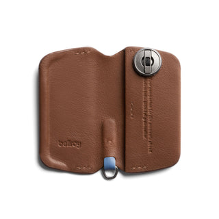 Bellroy Key Cover Third Edition in brown leather open to reveal key attachment mechanism and embossed logo