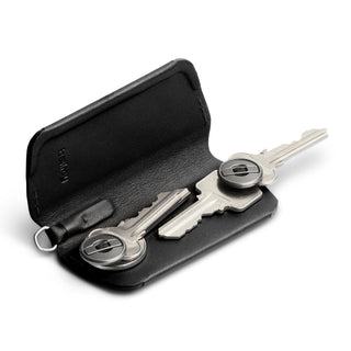 Bellroy Key Cover Plus Third Edition in black leather holding three silver keys inside compact case