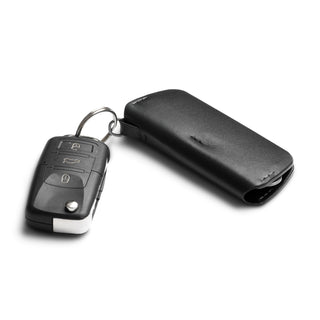 Bellroy Key Cover Plus Third Edition in black leather attached to a car key on a ring