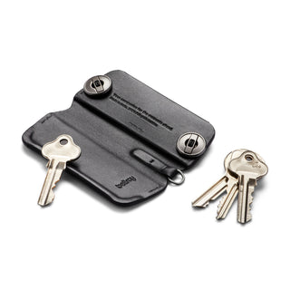 Bellroy Key Cover Plus Third Edition in black leather with metal screws and attached keys on white background
