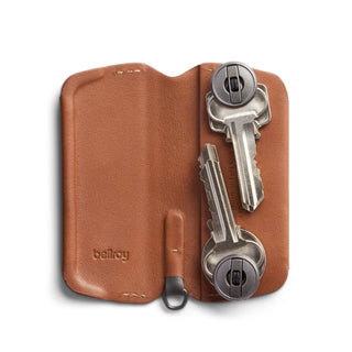Bellroy Key Cover Plus Third Edition in brown leather holding four metal keys securely inside