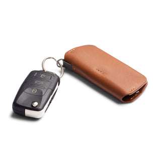 Bellroy Key Cover Plus Third Edition in tan leather protecting a set of car keys on white background