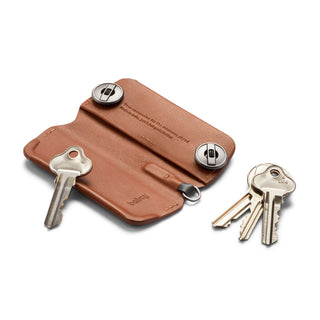 Bellroy Key Cover Plus Third Edition in tan leather with metal button closures and attached keys