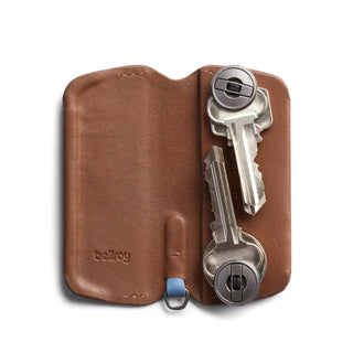 Bellroy Key Cover Plus Third Edition in brown leather holding multiple silver keys with secure fasteners