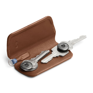 Bellroy Key Cover Plus Third Edition in brown leather holding two metal keys securely with compact design