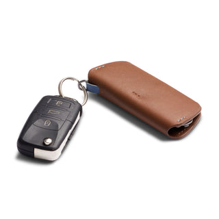 Bellroy Key Cover Plus Third Edition in brown leather attached to a black car key with metal ring