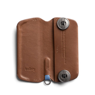 Bellroy Key Cover Plus Third Edition in brown leather with metal key fasteners and blue pull tab detail