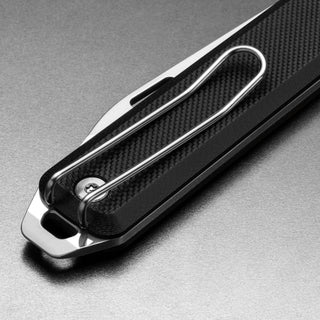 James The Ellis Slim Knife showing black textured G10 handle with polished metal pocket clip close-up
