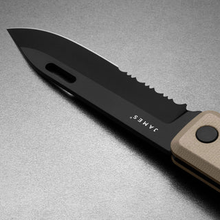 James The Ellis Slim Knife with black serrated Sandvik steel blade and textured tan G10 handle close-up