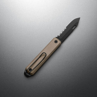 James The Ellis Slim Knife with tan G10 handle and partially serrated black blade displayed on gray surface