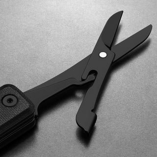 James The Ellis Scissors Knife showing black stainless steel blades and textured handle details