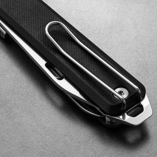 James The Ellis Scissors Knife with textured black G10 handle and stainless steel clip close-up view