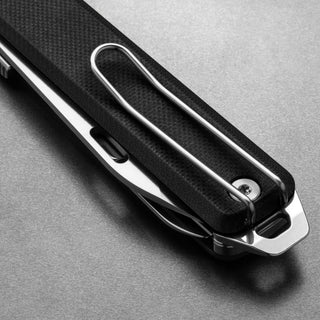 James The Ellis Scissors Knife showing black Micarta handle with silver metal clip on gray background