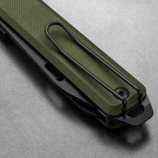 James The Ellis Scissors Knife by The James Brand with textured green Micarta handle and black clip detailed close-up