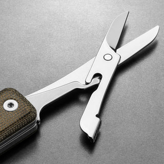 James The Ellis Scissors Knife showing polished stainless steel blades and textured micarta handle detail