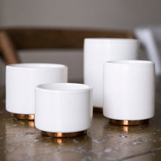 FELLOW Monty Espresso Cups (3oz/89ml) (2-Pack) white ceramic with copper bottom set on table