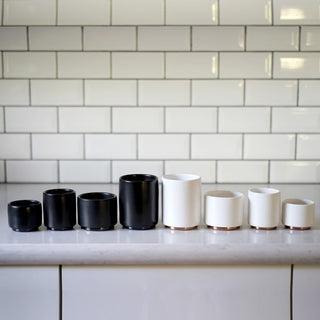 FELLOW Monty Espresso Cups (3oz/89ml) (2-Pack) showing black and white ceramic cups with copper bases