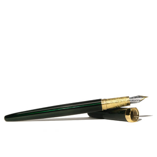 The Bijou Fountain Pen - Emerald Gardens by Ferris Wheel Press with green lacquer and gold trim shown uncapped