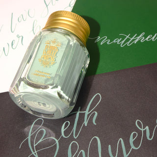 28ml Calligraphy Ink - Sage Advice | Ferris Wheel Press glass bottle with gold lid on calligraphy paper background