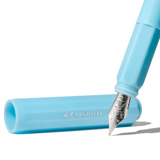The Carousel Fountain Pen - Feathered Flight | Ferris Wheel Press with blue cap and silver nib visible