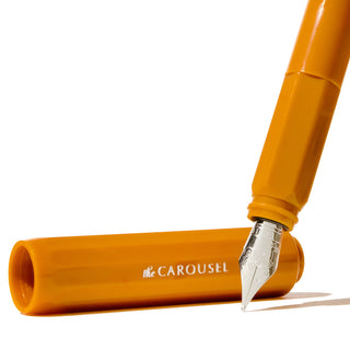 The Carousel Fountain Pen - Hearty Harvest | Ferris Wheel Press with glossy orange barrel and silver nib close-up